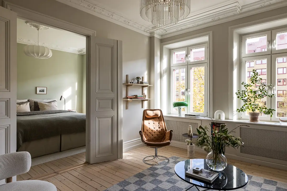 A Classic Renovated Apartment with a Social Light Green Kitchen 2 scandi living room large windows