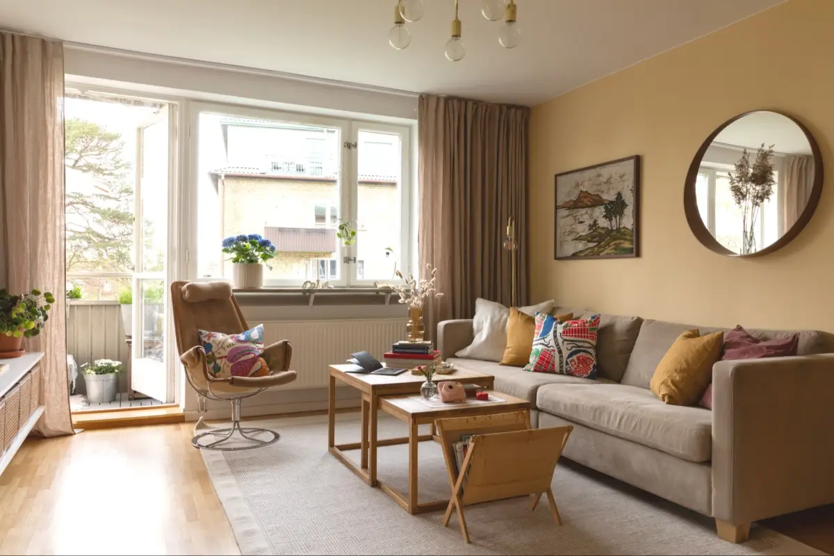 A Well-Preserved 1950s Apartment North of Stockholm 1 scandi living room ochre yellow wall