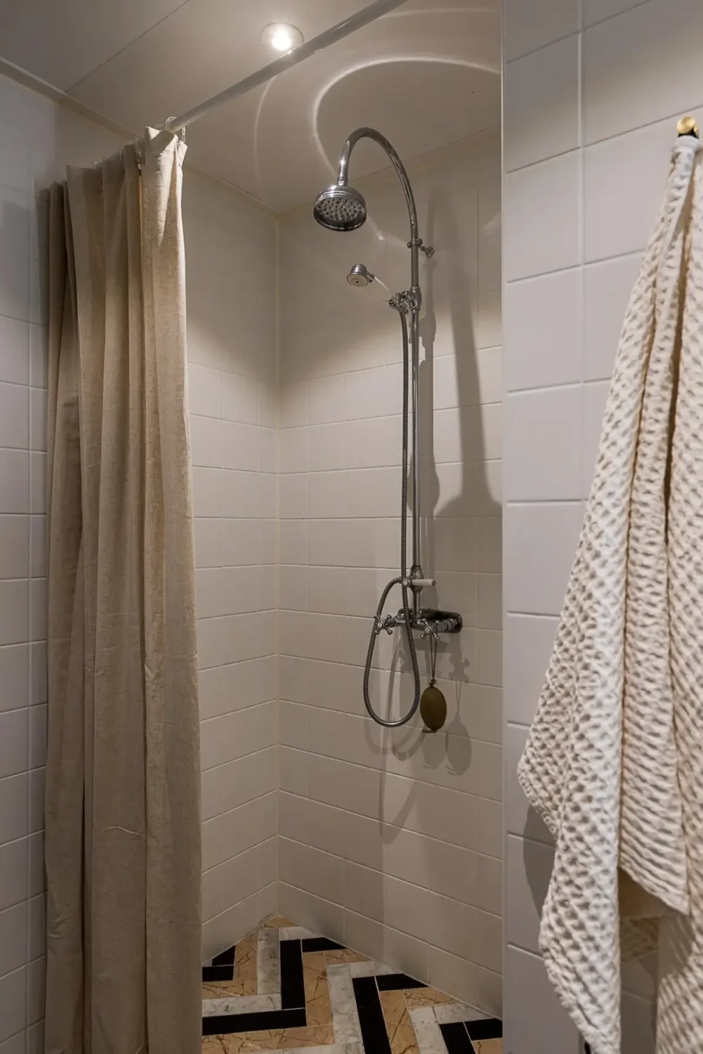 Gray Tones, Wallpapers, and a Mint Green Fireplace in a Swedish Apartment 31 shower herringbone floor tiles