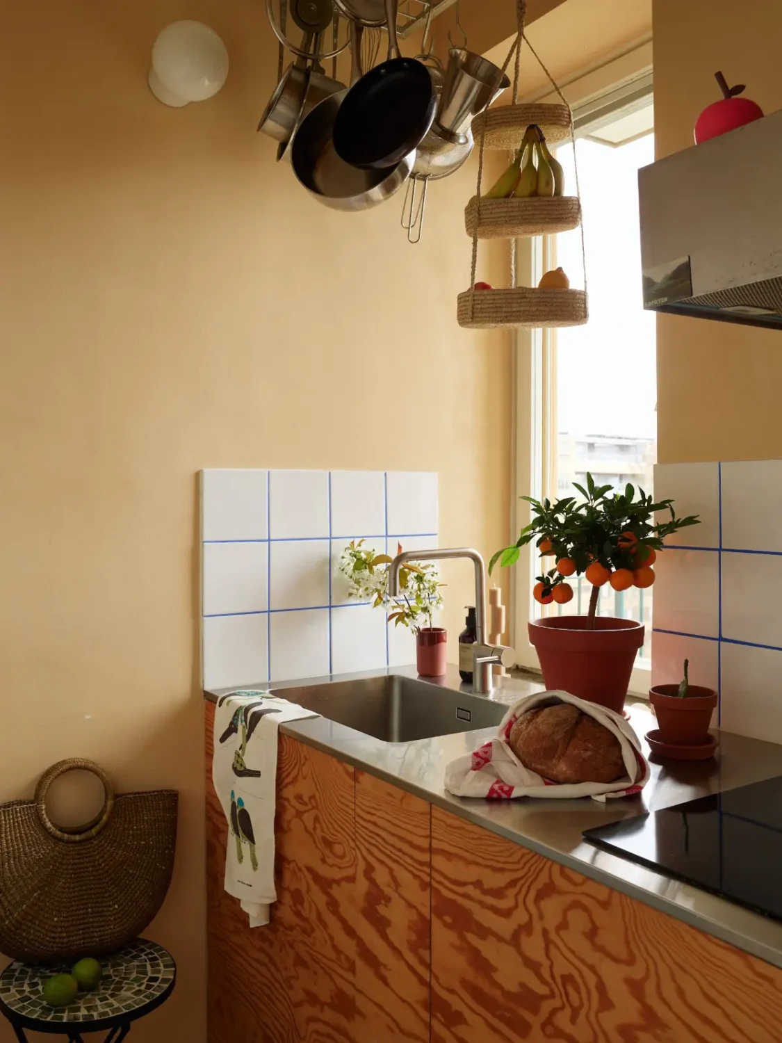 The Color Trends for 2026: A Return to Nature, Balance, and Grounding 13 small plywood kitchen warm wall color white tiles nordroom The Color Trends for 2026: A Return to Nature, Balance, and Grounding