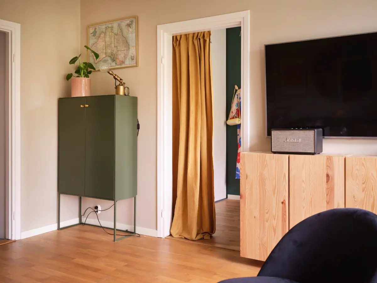 A Natural Color Palette in a Swedish 1940s Apartment 7 velvet ochre doorway curtain