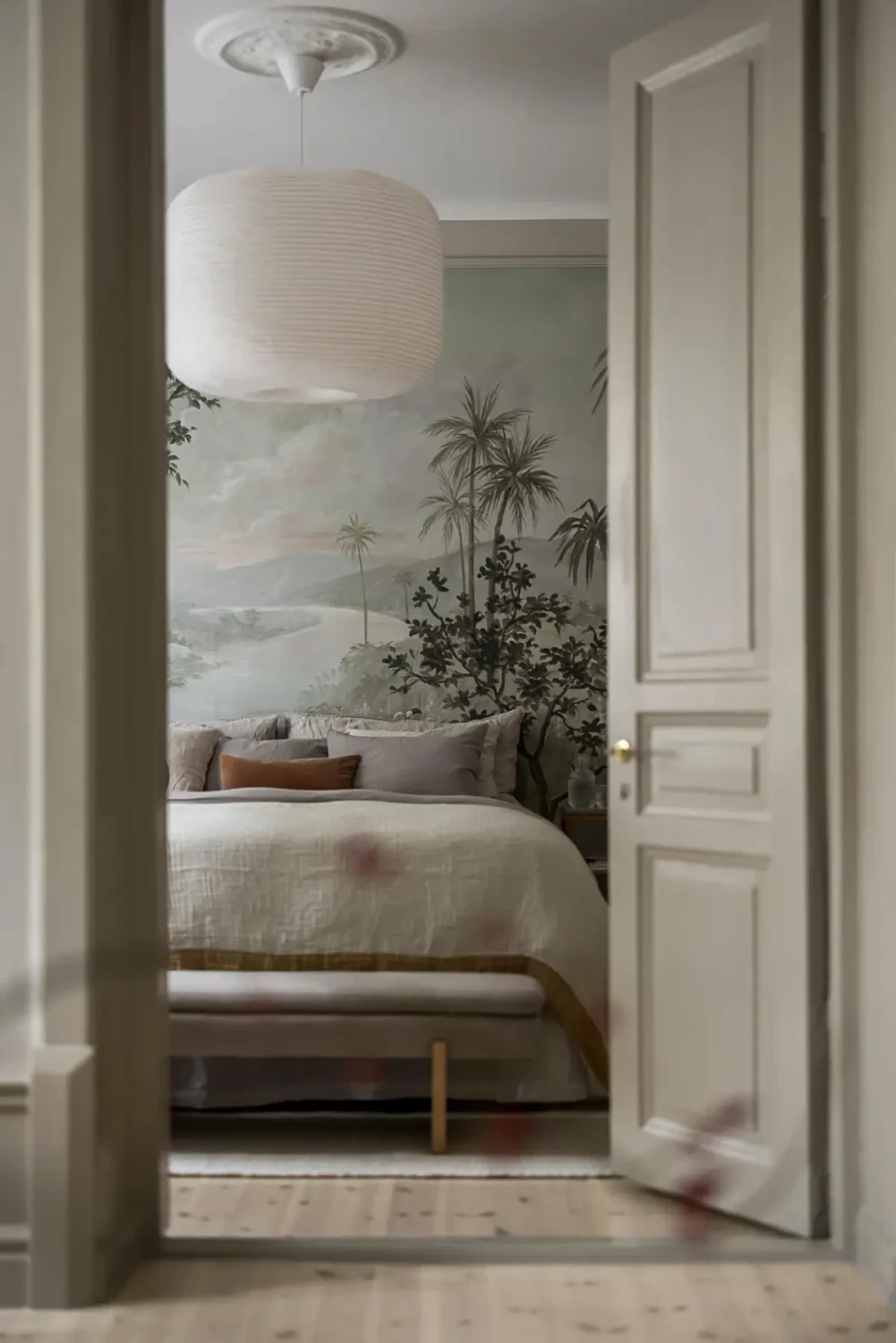 Gray Tones, Wallpapers, and a Mint Green Fireplace in a Swedish Apartment 14 view into bedroom