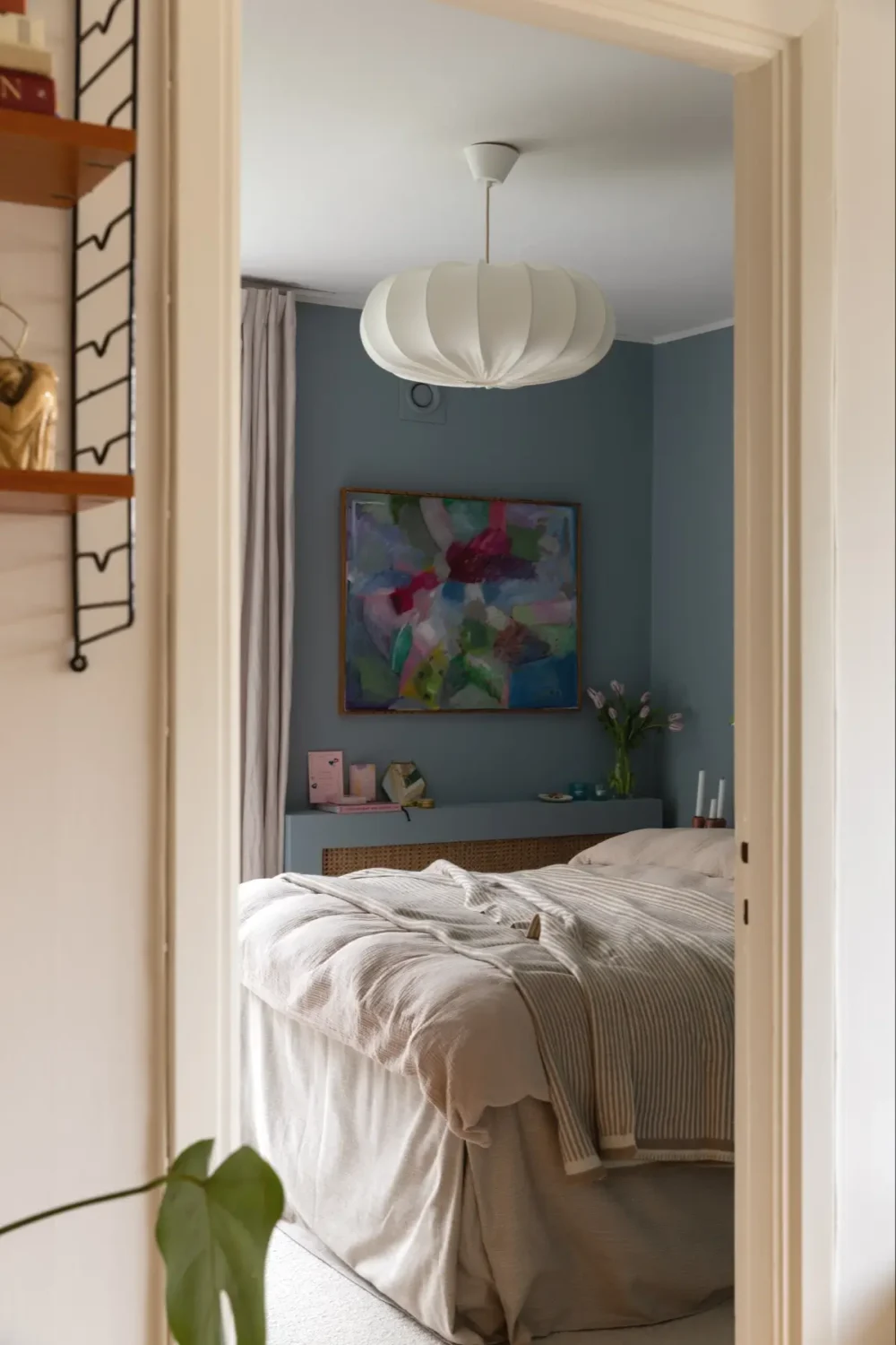 A Well-Preserved 1950s Apartment North of Stockholm 19 view into blue bedroom