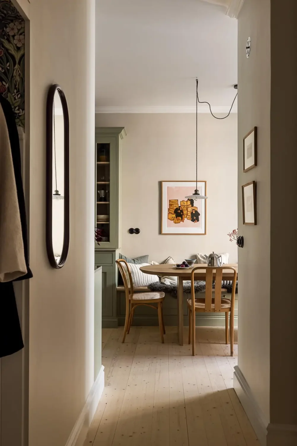 A Classic Renovated Apartment with a Social Light Green Kitchen 34 view into kitchen