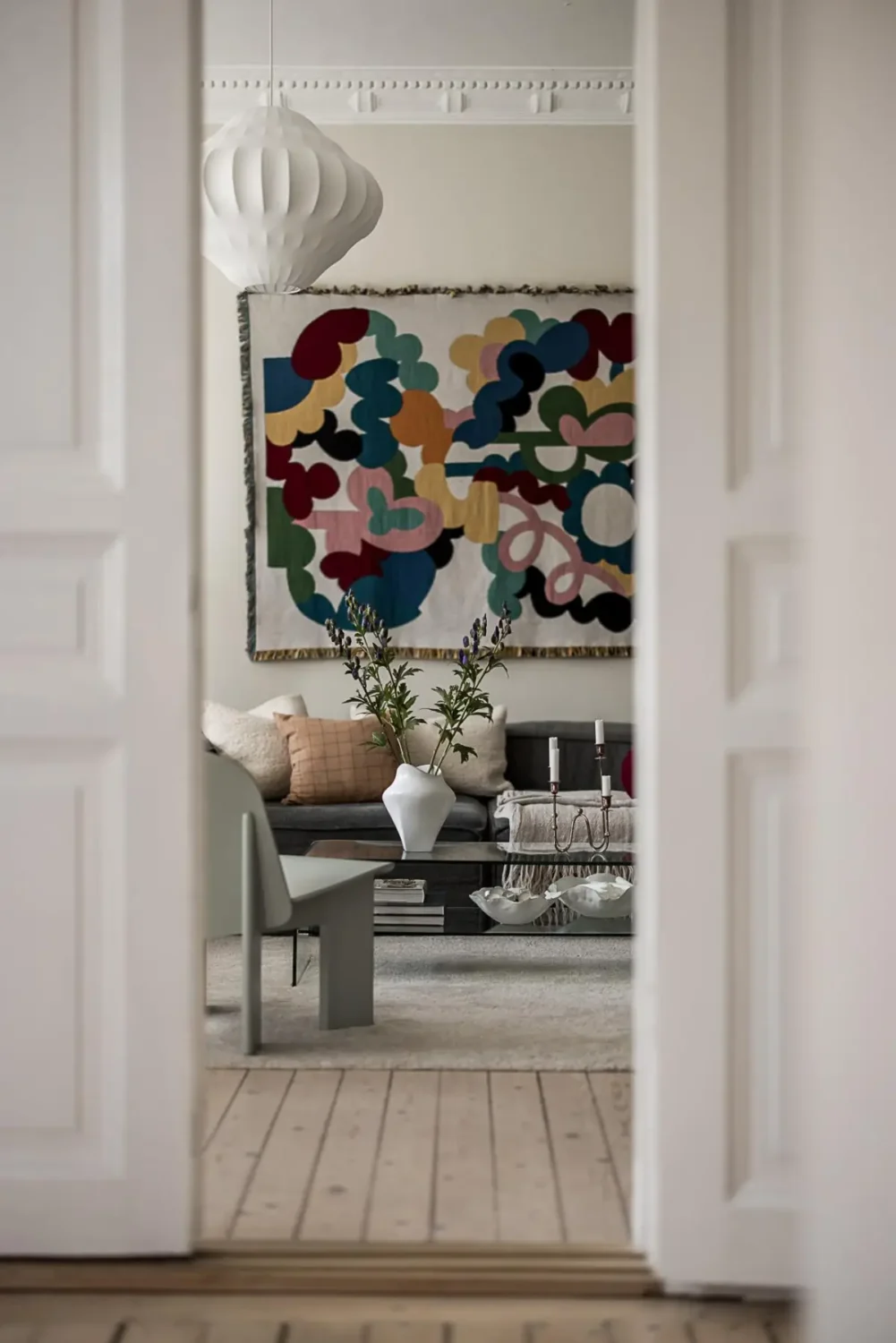 Warm Neutral Tones and Period Features in a Swedish Apartment 11 view into living room