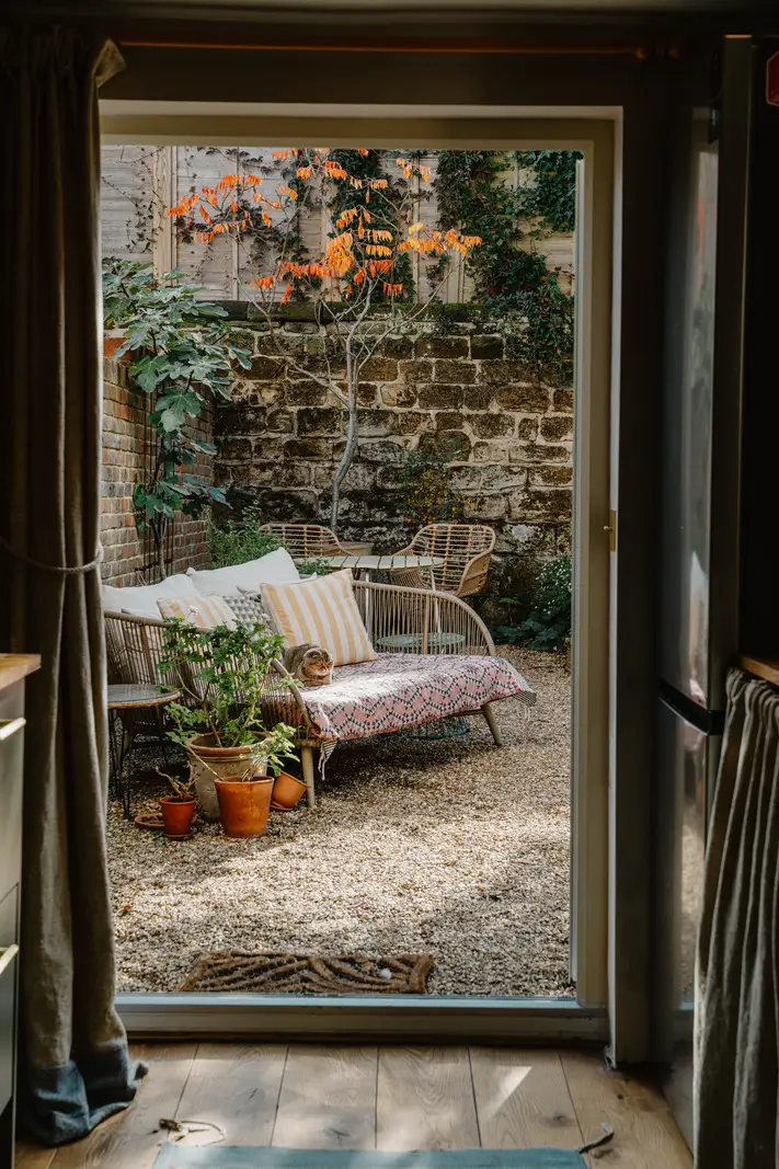 Cozy Interiors in a Restored 19th Century Family Home in Tunbridge Wells 28 walled garden sofa