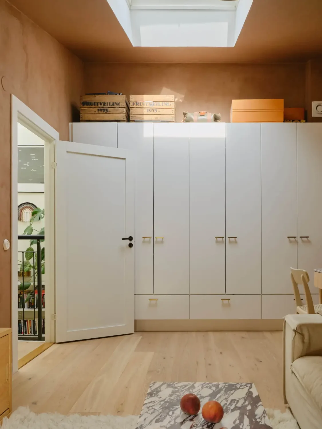 Former Stables Transformed into a Modern, Light House with Plaster Walls 16 wardrobe wall skylight