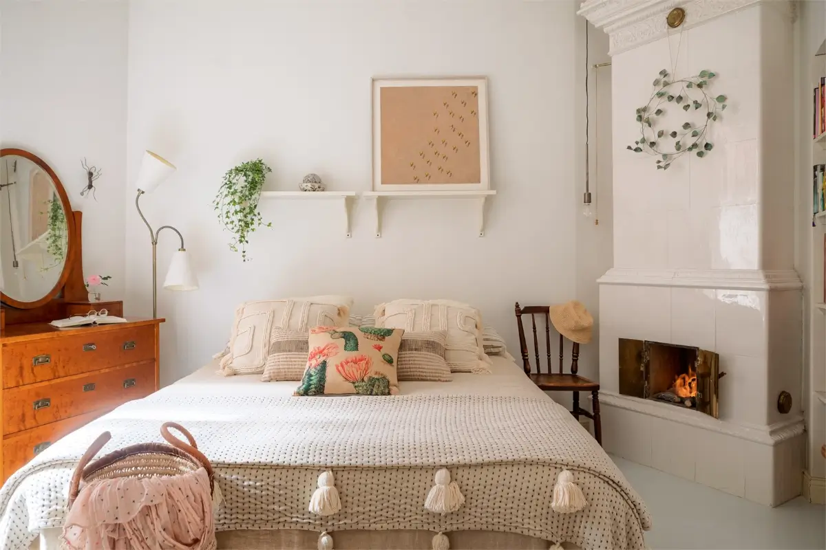 A Light-Filled Stockholm Apartment with a Charming Kitchen 23 white bedroom antique vanity table fireplace
