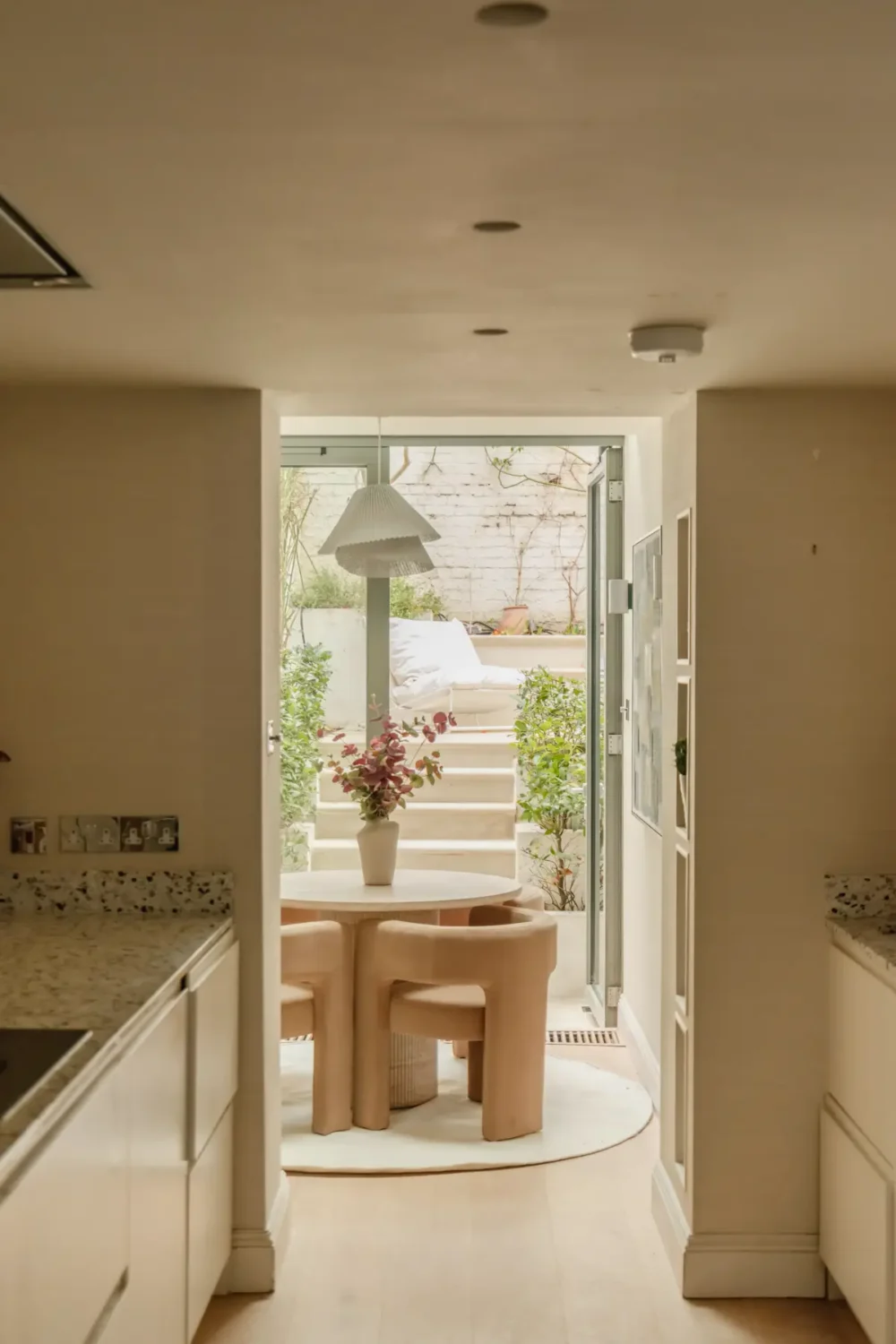 A Serene Duplex Apartment with a Glass Extension in London 10 white galley kitchen dining room