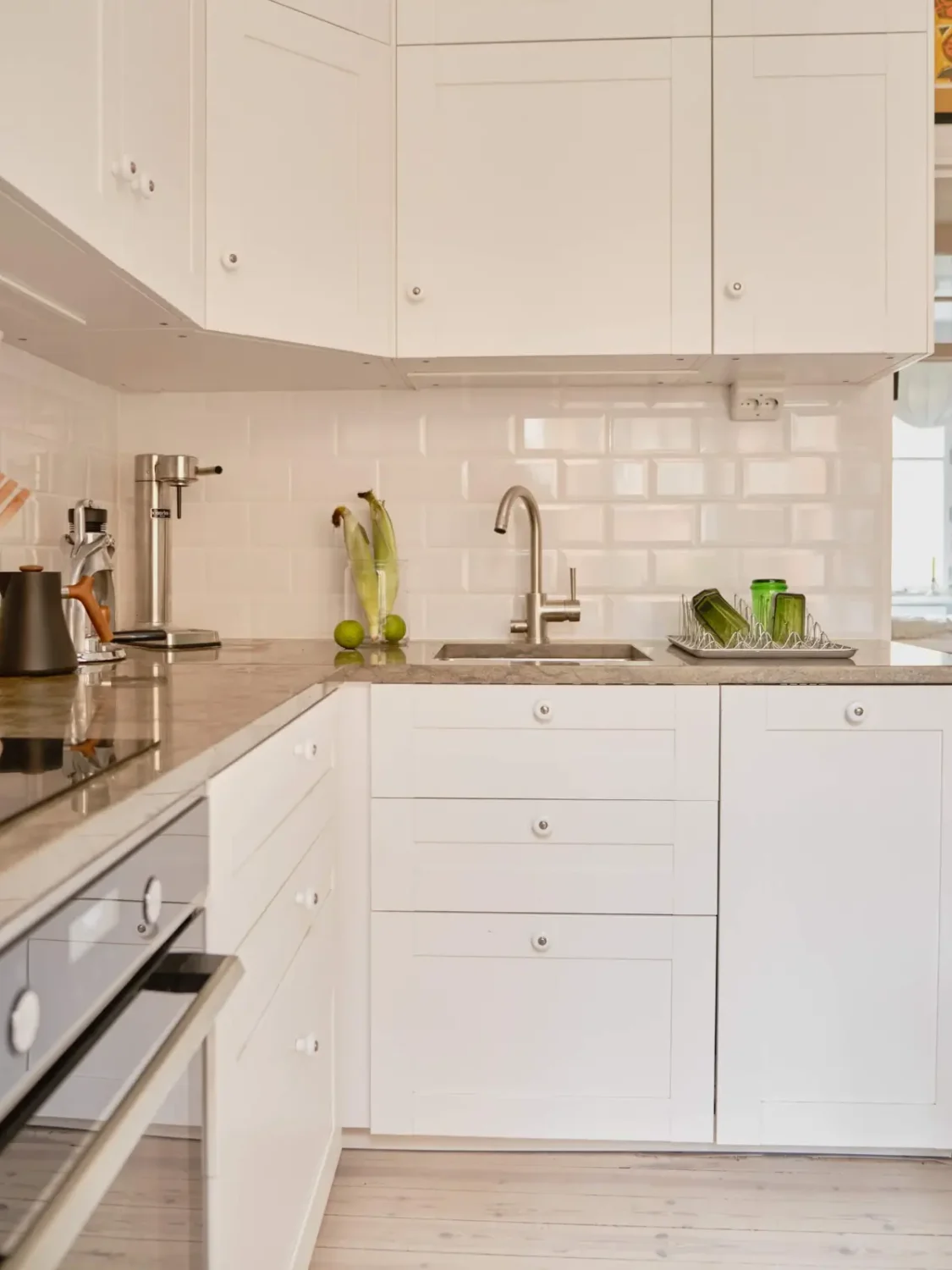 Green and Apricot Rooms in a Charming Stockholm Apartment 17 white kitchen