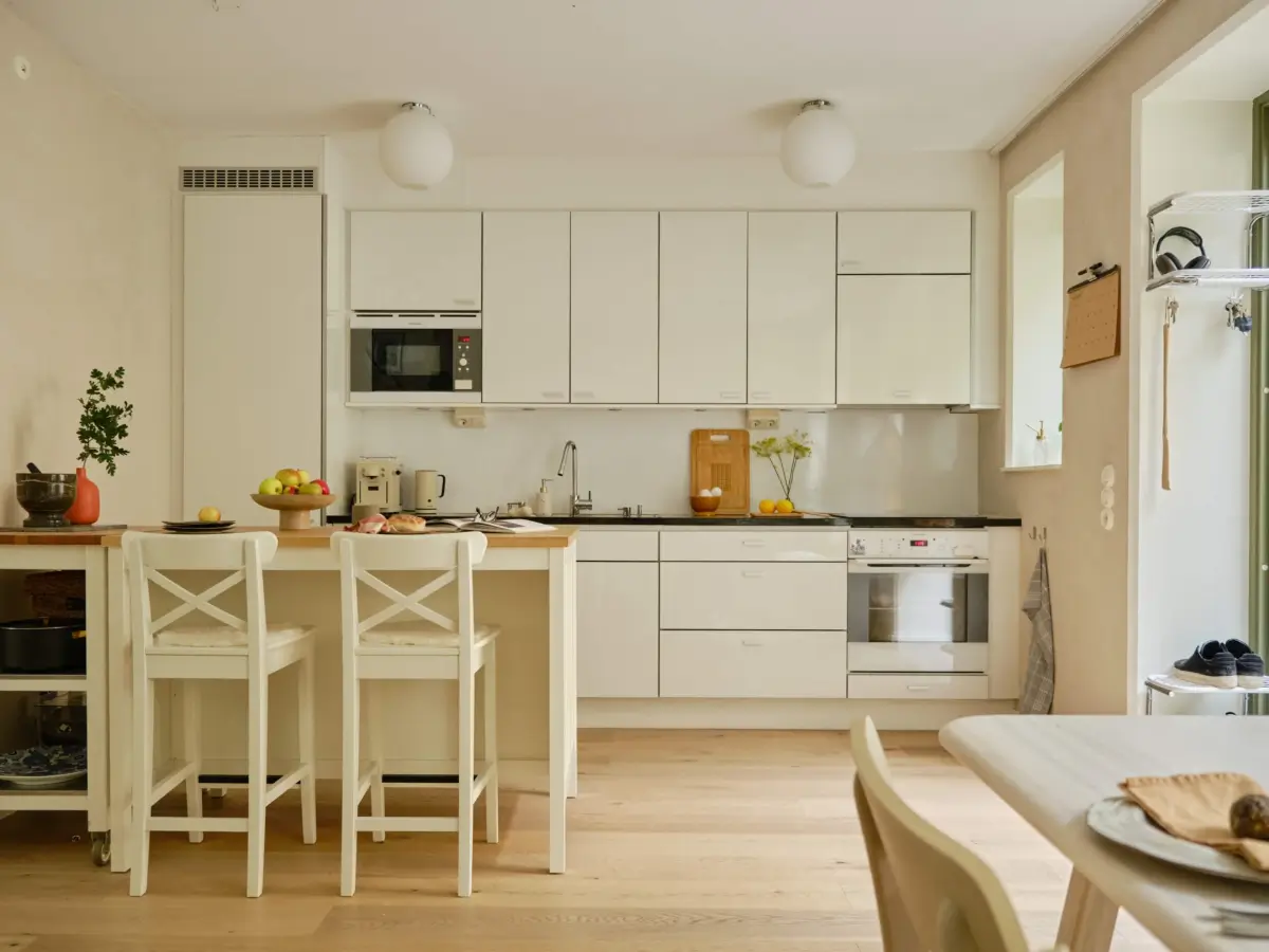 Former Stables Transformed into a Modern, Light House with Plaster Walls 5 white kitchen ikea island breakfast bar