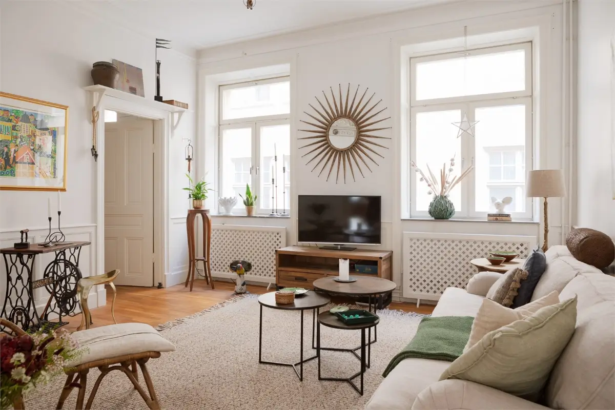 A Light-Filled Stockholm Apartment with a Charming Kitchen 12 white living room large rug