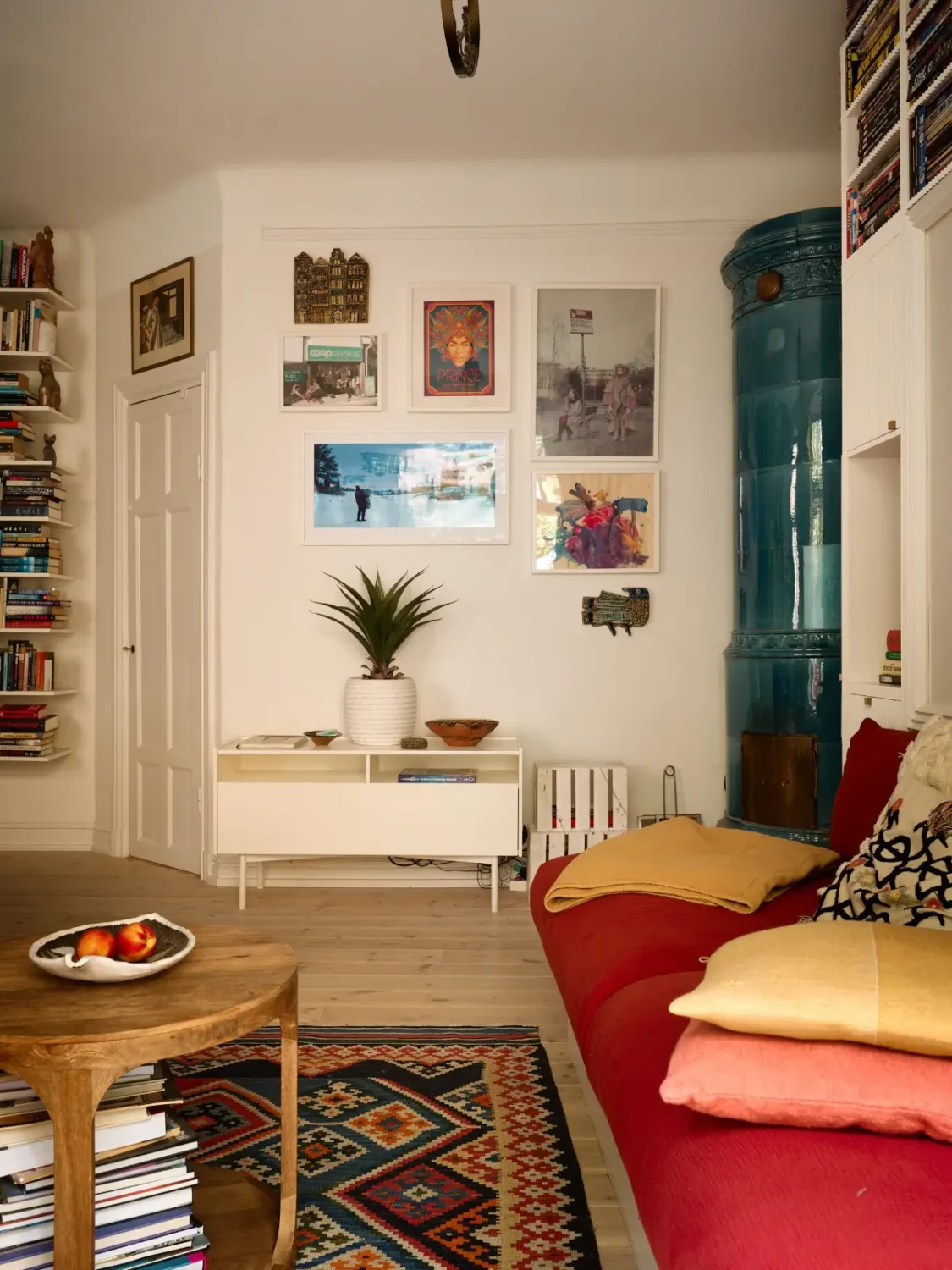 A Well-Planned Family Apartment with Historic Character 12 white living room wooden floor blue fireplace