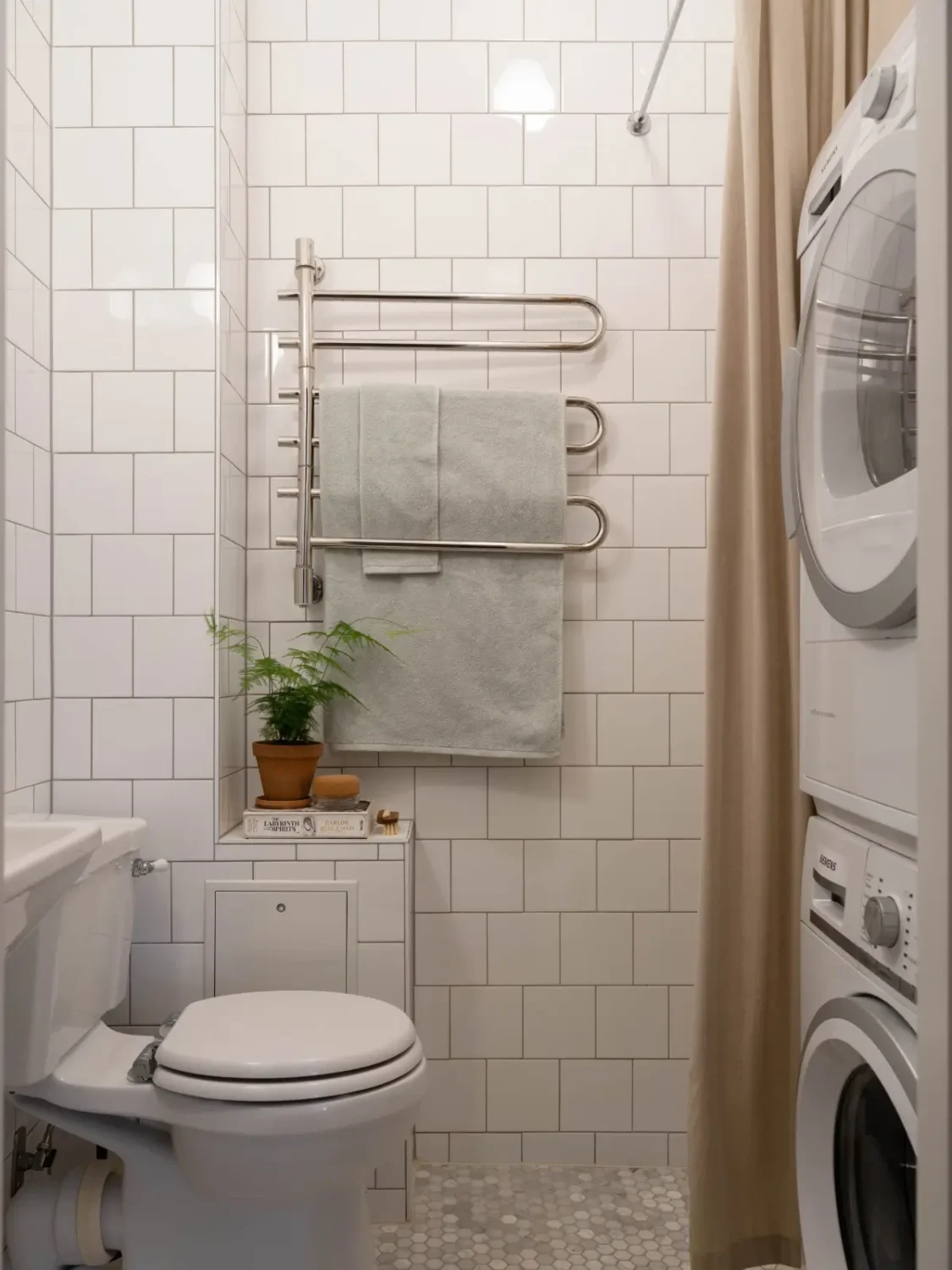 A Light and Spacious Corner Apartment in a 19th-Century Building 34 white tiled bathroom