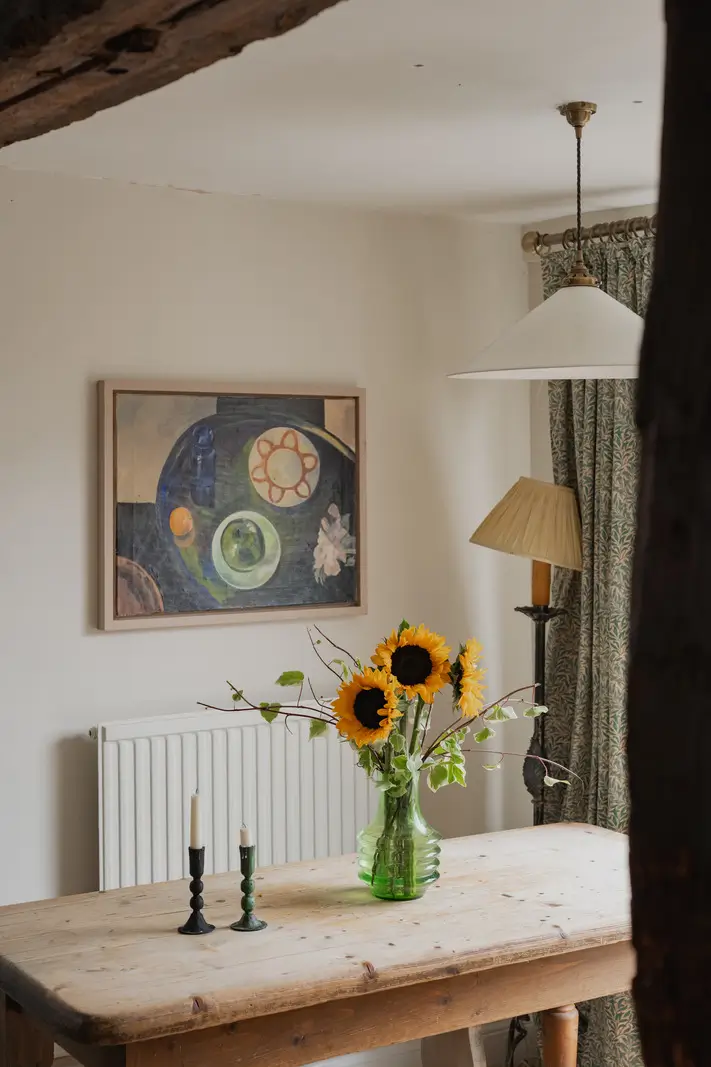 A Charming English Cottage with a Sage-Green Kitchen 9 wooden kitchen table
