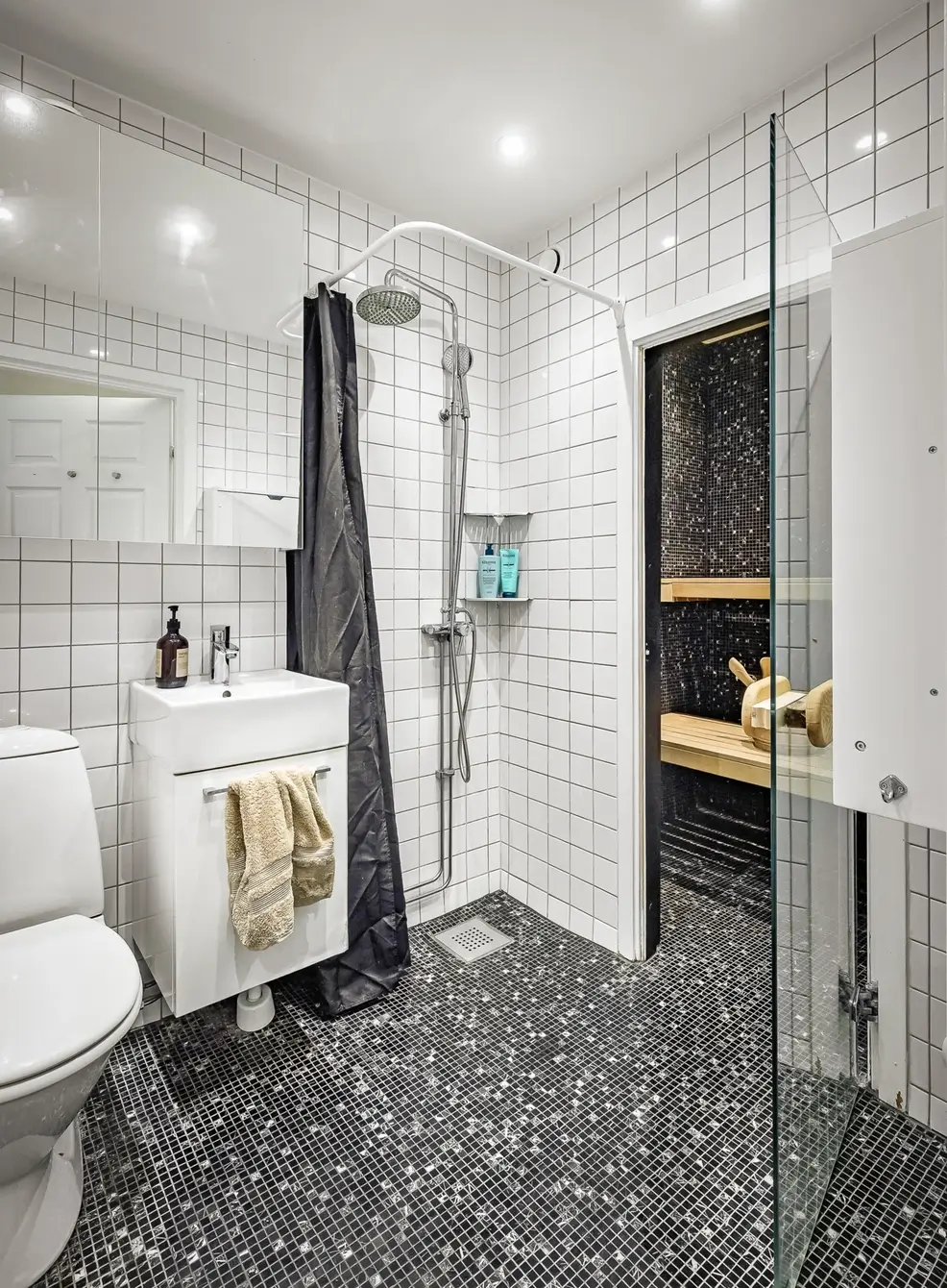 A Bright Duplex Apartment with Exposed Beams and a Roof Terrace 31 bathroom-sauna-sparkly-floor-tiles-nordroom