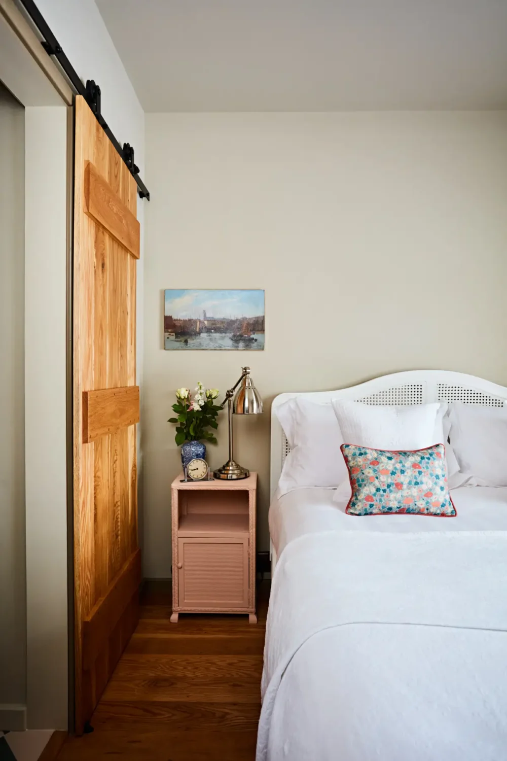 Natural Materials and Green Tones in a Pretty Coastal Home 12 bedroom pink nighstand wooden barn door