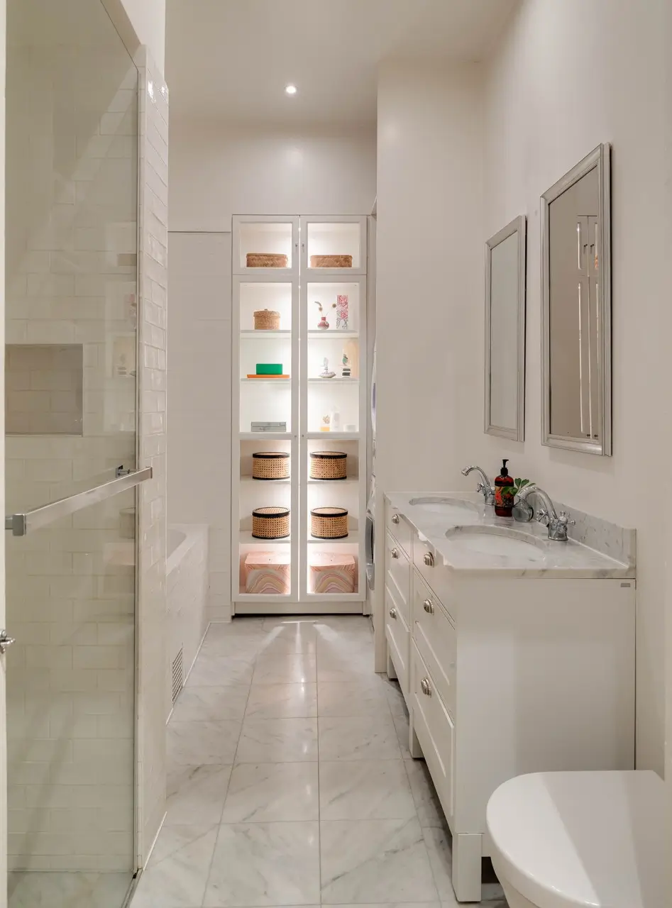 Classic Elements and Modern Comforts in an Elegant Apartment 10 classic bathroom marble floor tiles built-in glass cabinet