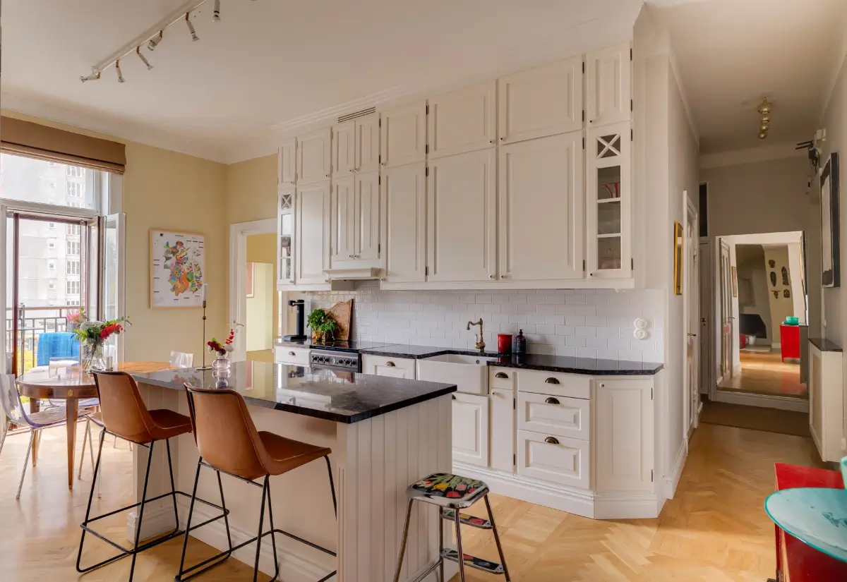 Classic Elements and Modern Comforts in an Elegant Apartment 1 classic kitchen with island yellow walls