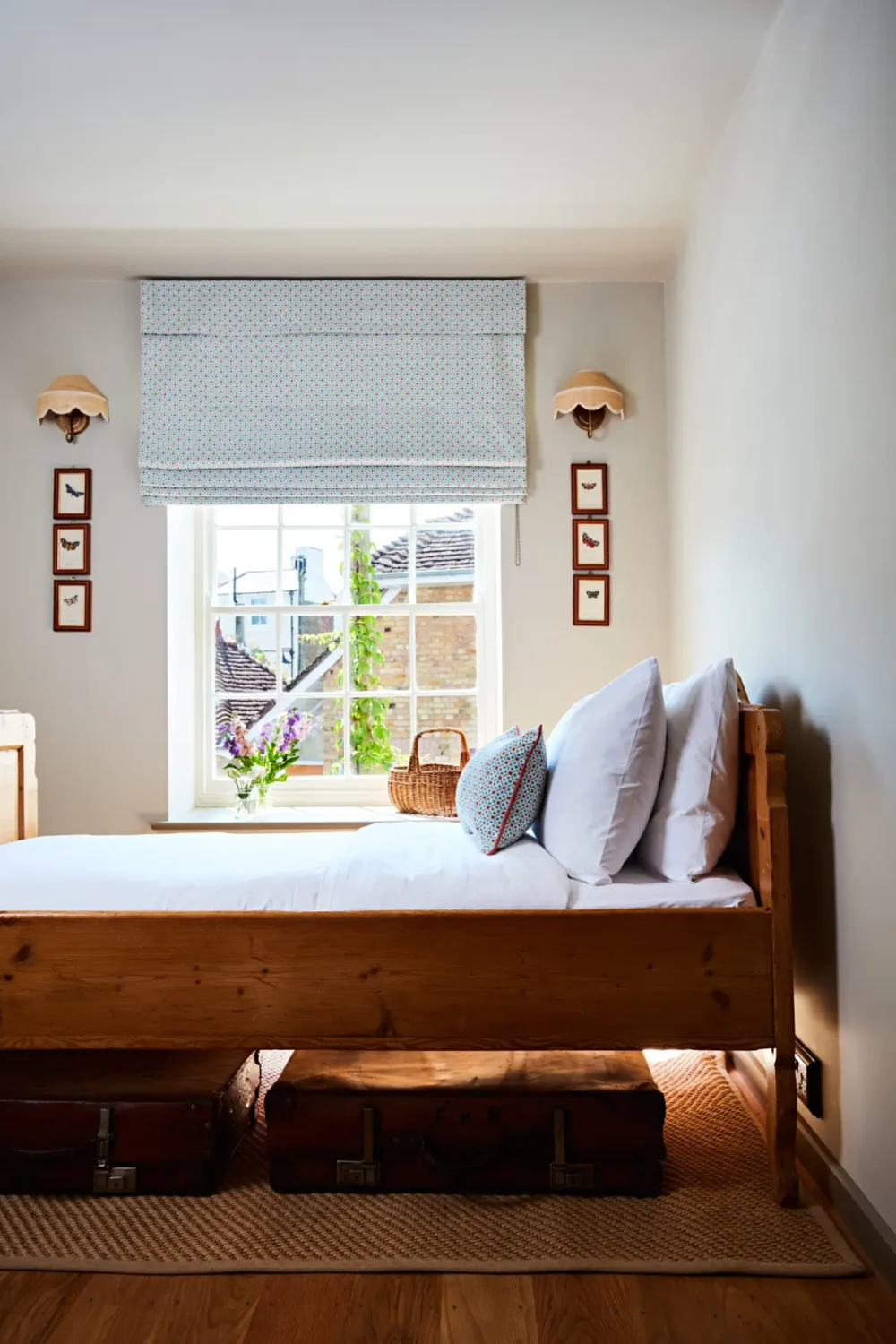 Natural Materials and Green Tones in a Pretty Coastal Home 17 cottage bedroom blue blinds
