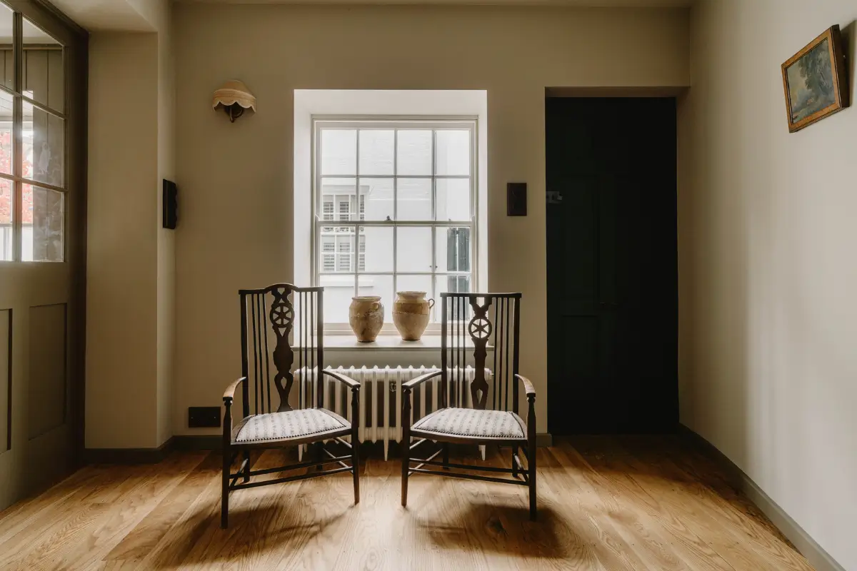 Natural Materials and Green Tones in a Pretty Coastal Home 7 sitting room sash window