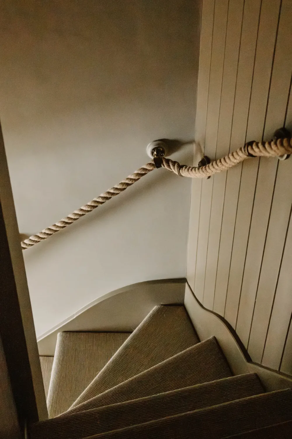 Natural Materials and Green Tones in a Pretty Coastal Home 9 stairs rope handrail