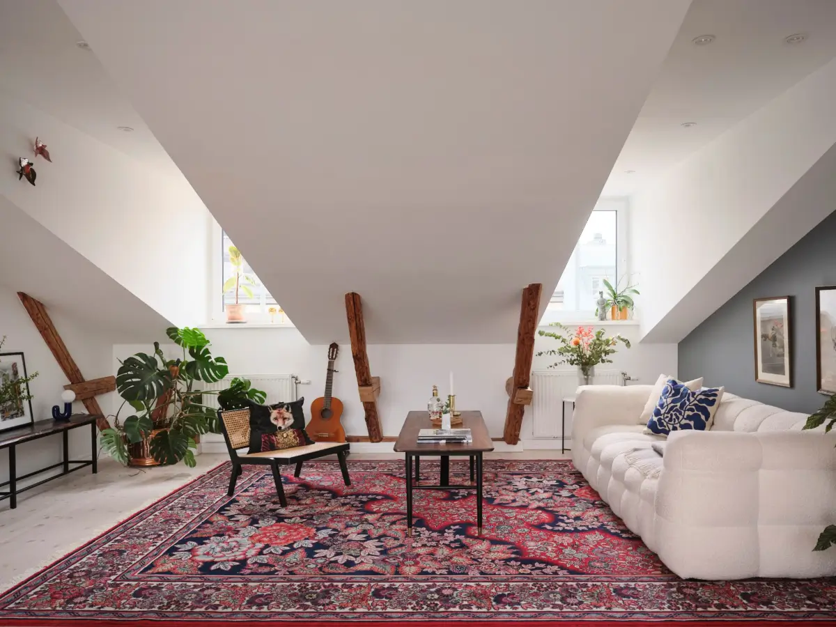 scandinavian-attic-apartment-wooden-beams-slanted-ceilings-nordroom