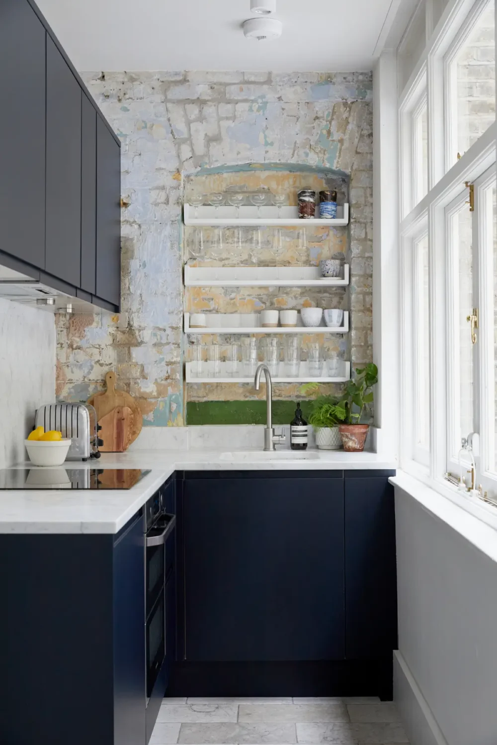 Small Space, Big Style: How to Design a Teeny-Tiny Kitchen That Works 9 tiny-kitchen-brick-wall-with-niche-shelves-nordroom