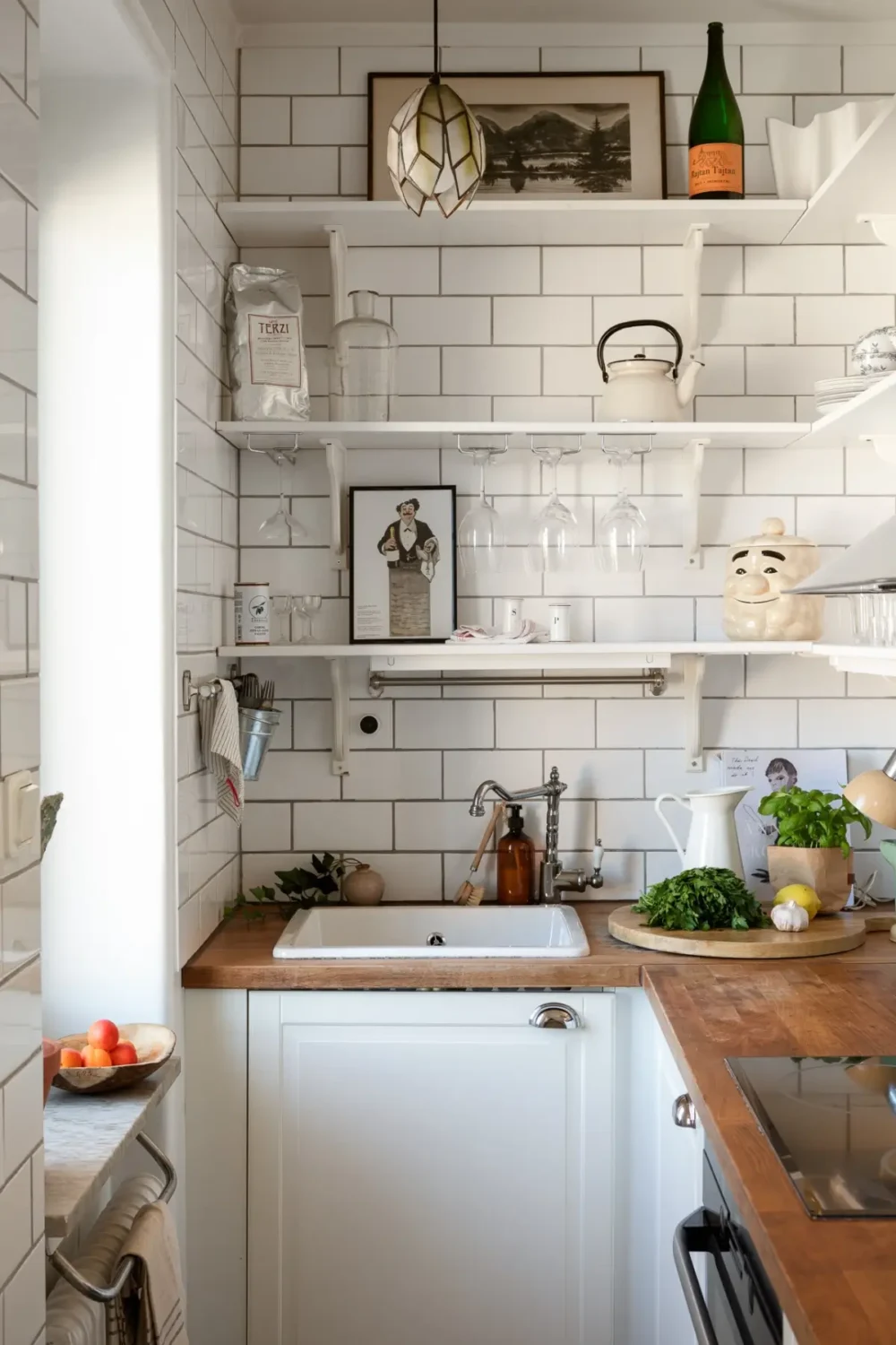 Small Space, Big Style: How to Design a Teeny-Tiny Kitchen That Works 16 tiny-kitchen-shelves-white-tiles-nordroom
