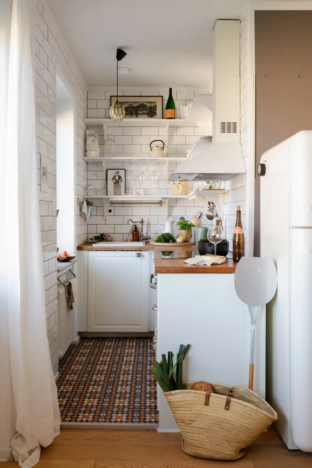 Small Space, Big Style: How to Design a Teeny-Tiny Kitchen That Works 15 tiny-kitchen-white-tiles-cabinets-shelves-nordroom