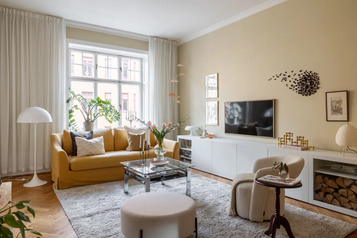 Warm Beige Tones and a Stylish Kitchen in a Stockholm Apartment 1 early-20th-century-apartment-beautiful-kitchen-and-fireplace