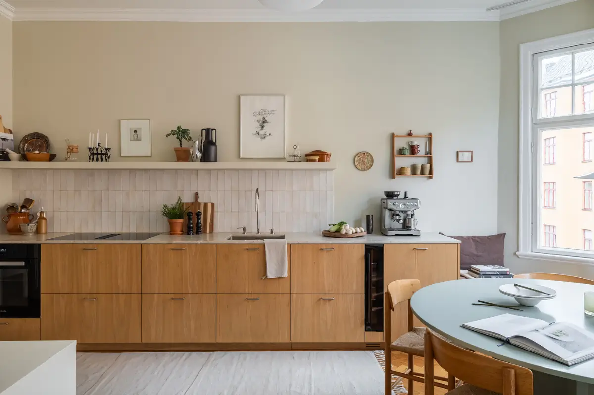Warm Beige Tones and a Stylish Kitchen in a Stockholm Apartment 14 early-20th-century-apartment-beautiful-kitchen-and-fireplace