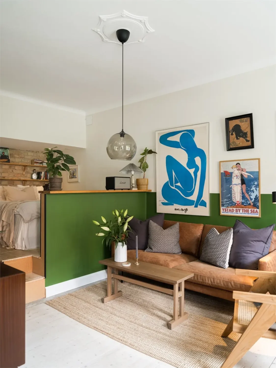 Studio Apartment Layout Ideas: Living Small is Looking Good 20 studio-layout-raised-sleeping-area-behind-half-wall-nordroom