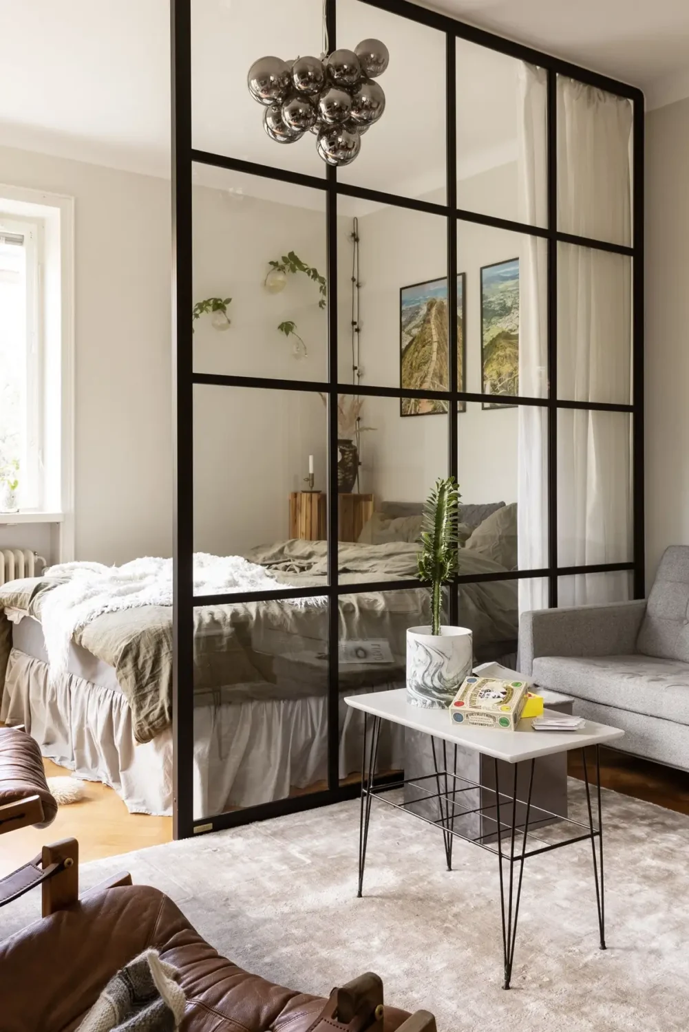 Studio Apartment Layout Ideas: Living Small is Looking Good 7 studio-layout-sofa-bed-side-by-side-industrial-room-divider-nordroom