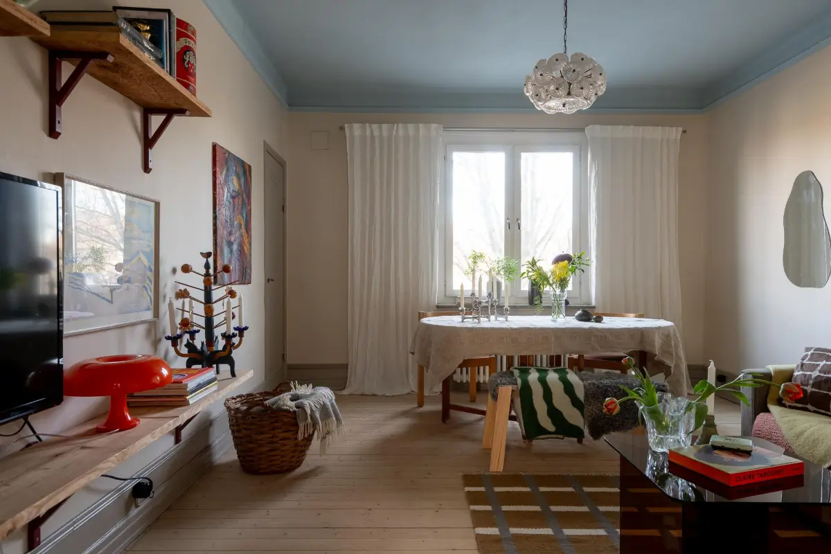 Preserved Details and a Warm Yellow Kitchen in a 1920s Apartment 15 yellow-kitchen-light-blue-living-room-ceiling-swedish-apartment