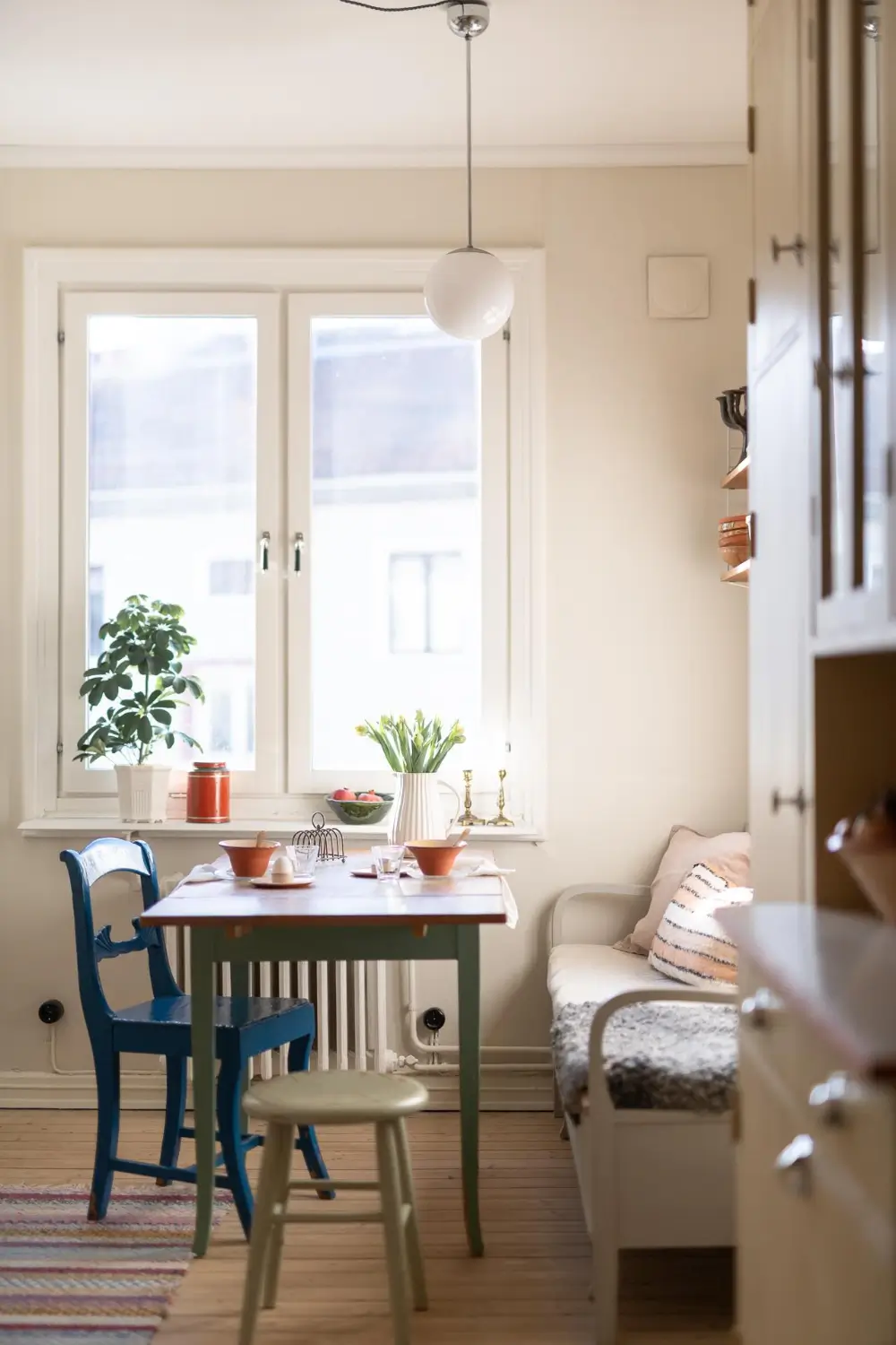 Preserved Details and a Warm Yellow Kitchen in a 1920s Apartment 2 yellow-kitchen-light-blue-living-room-ceiling-swedish-apartment