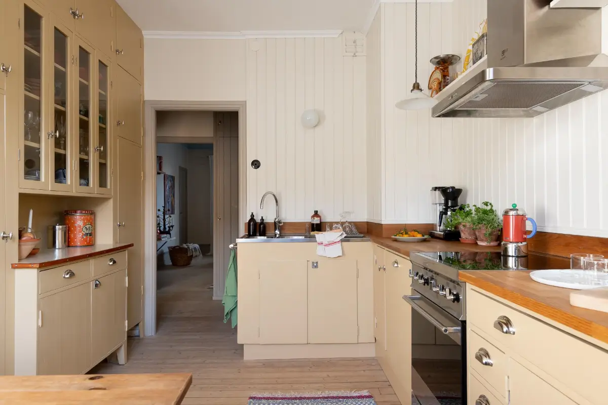 Preserved Details and a Warm Yellow Kitchen in a 1920s Apartment 9 yellow-kitchen-light-blue-living-room-ceiling-swedish-apartment