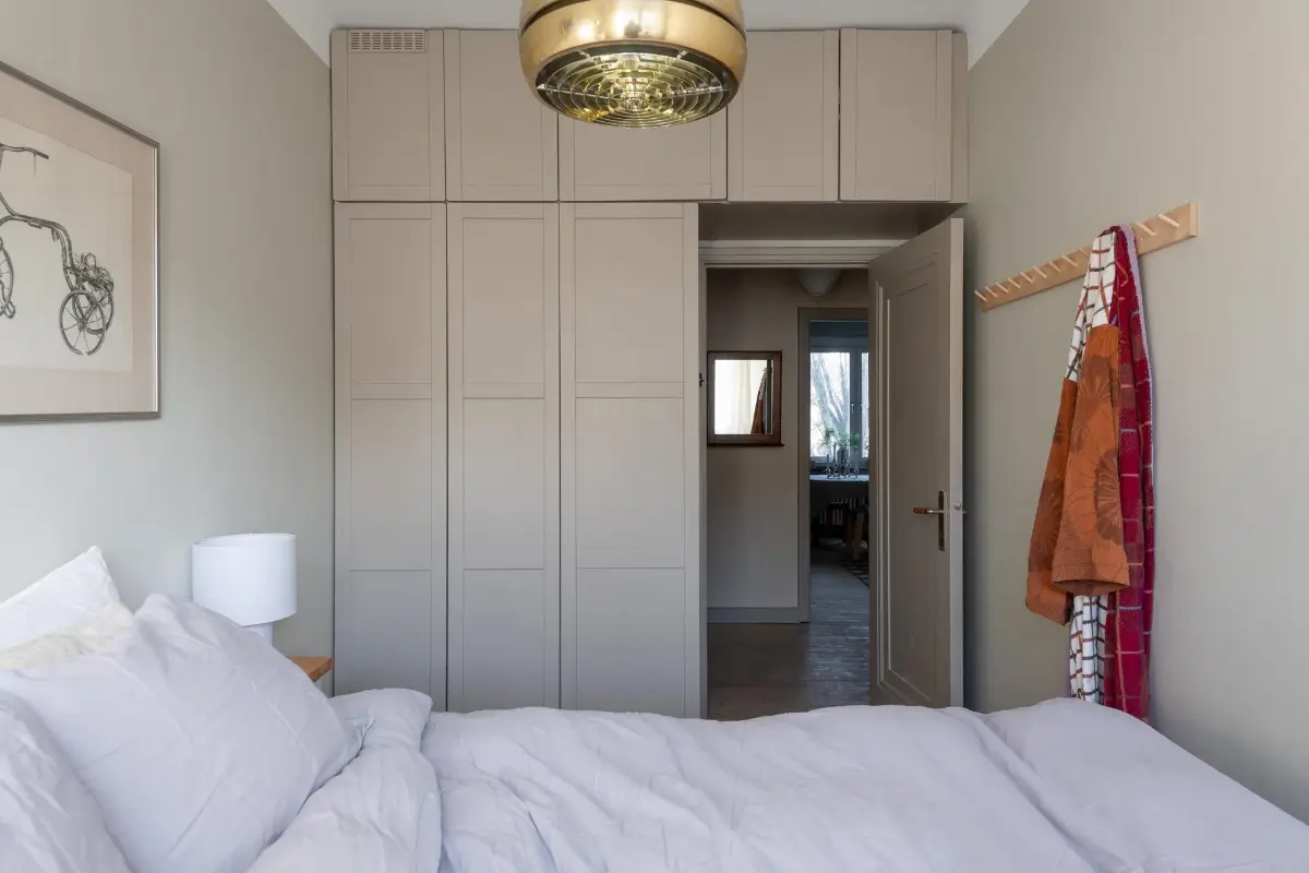 Preserved Details and a Warm Yellow Kitchen in a 1920s Apartment 23 yellow-kitchen-light-blue-living-room-ceiling-swedish-apartment