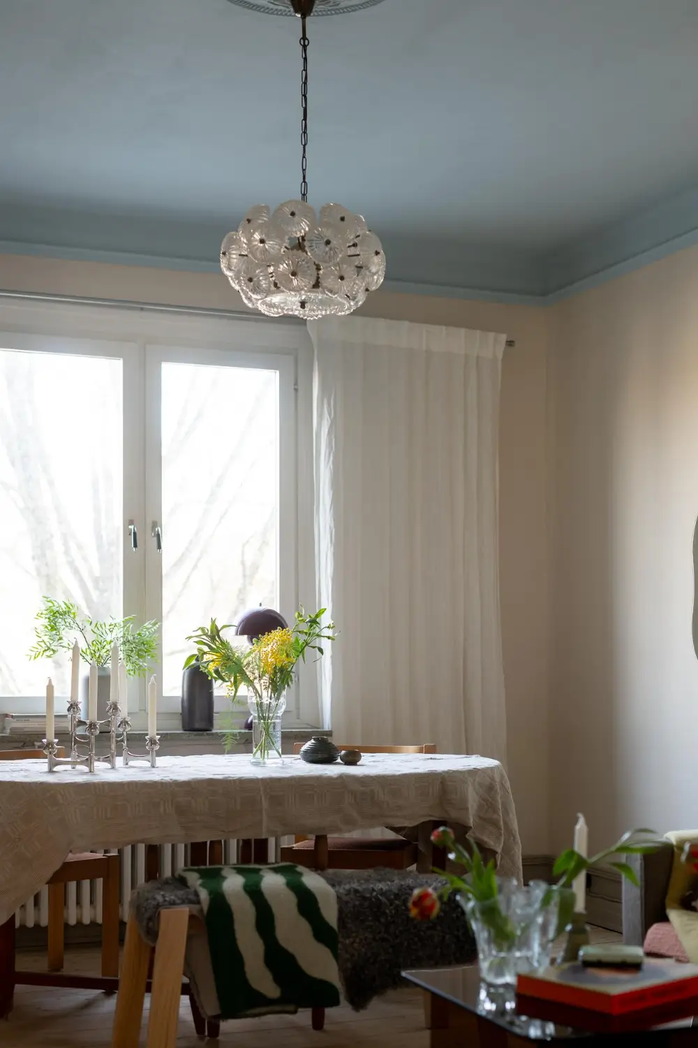 Preserved Details and a Warm Yellow Kitchen in a 1920s Apartment 13 yellow-kitchen-light-blue-living-room-ceiling-swedish-apartment