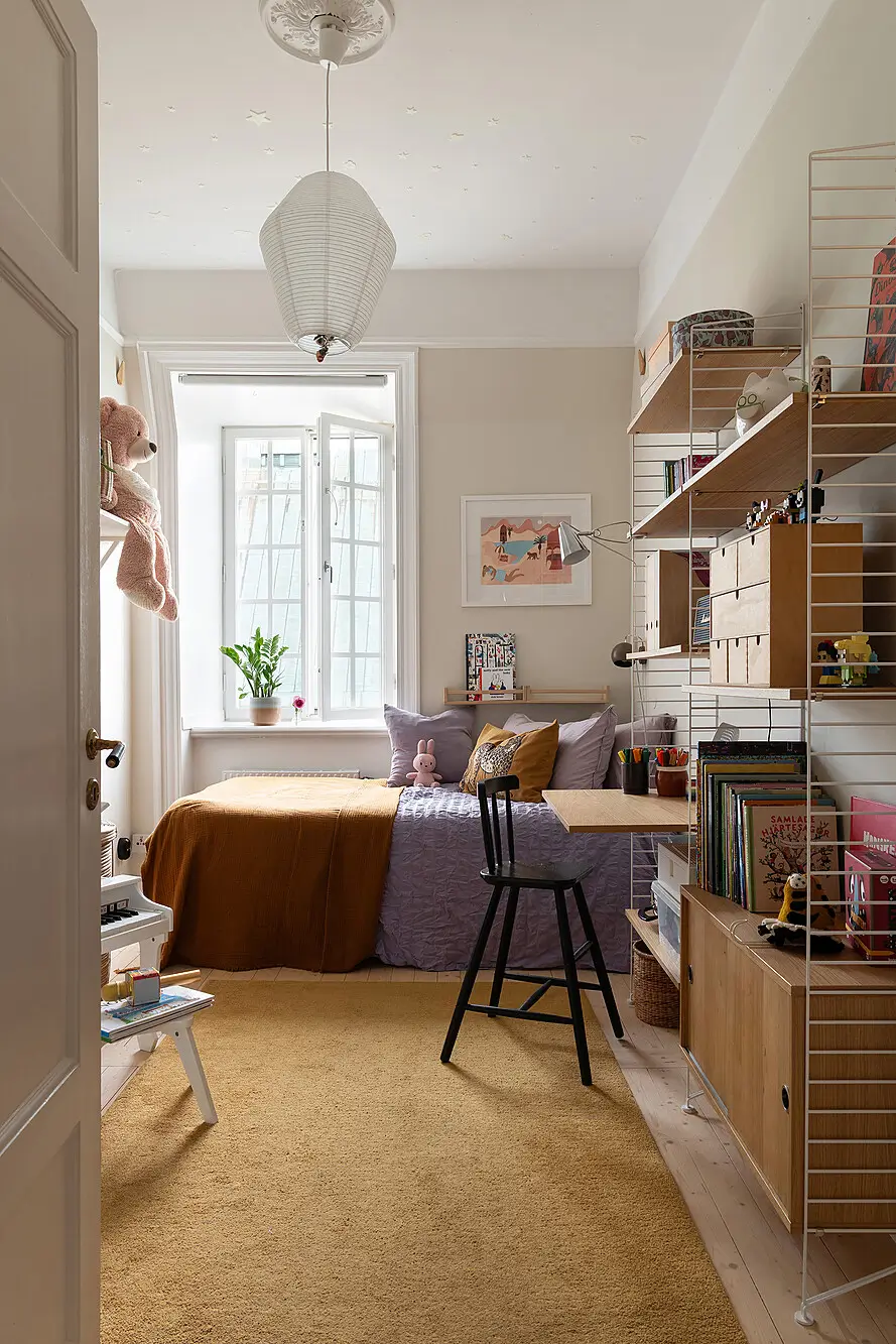 A Light Top-Floor Apartment with a Built-in Bookcase 20 floor-to-ceiling-bookcase-early-20th-century-apartment