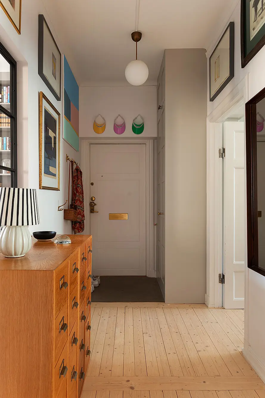 A Light Top-Floor Apartment with a Built-in Bookcase 26 floor-to-ceiling-bookcase-early-20th-century-apartment