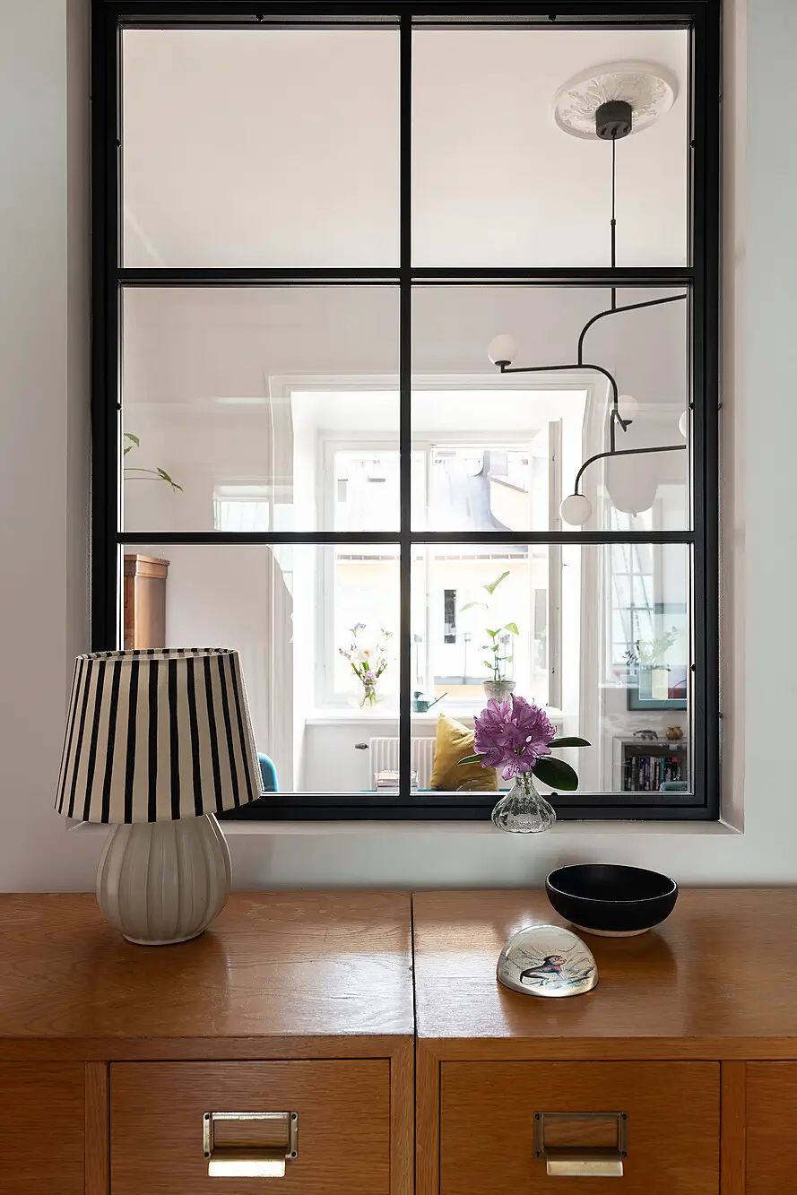 A Light Top-Floor Apartment with a Built-in Bookcase 24 floor-to-ceiling-bookcase-early-20th-century-apartment
