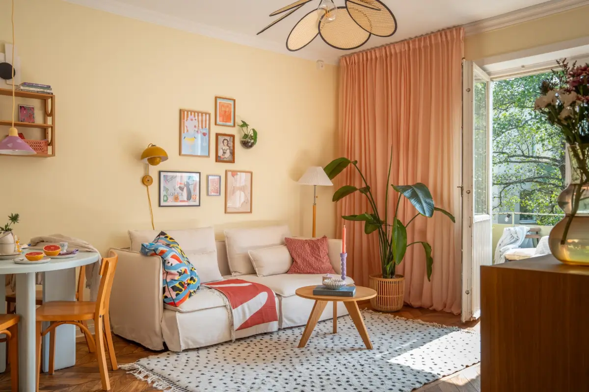 Cheerful Colors in a Small & Light 1940s Apartment in Stockholm 1 living room 1940s apartment yellow walls pink curtains nordroom