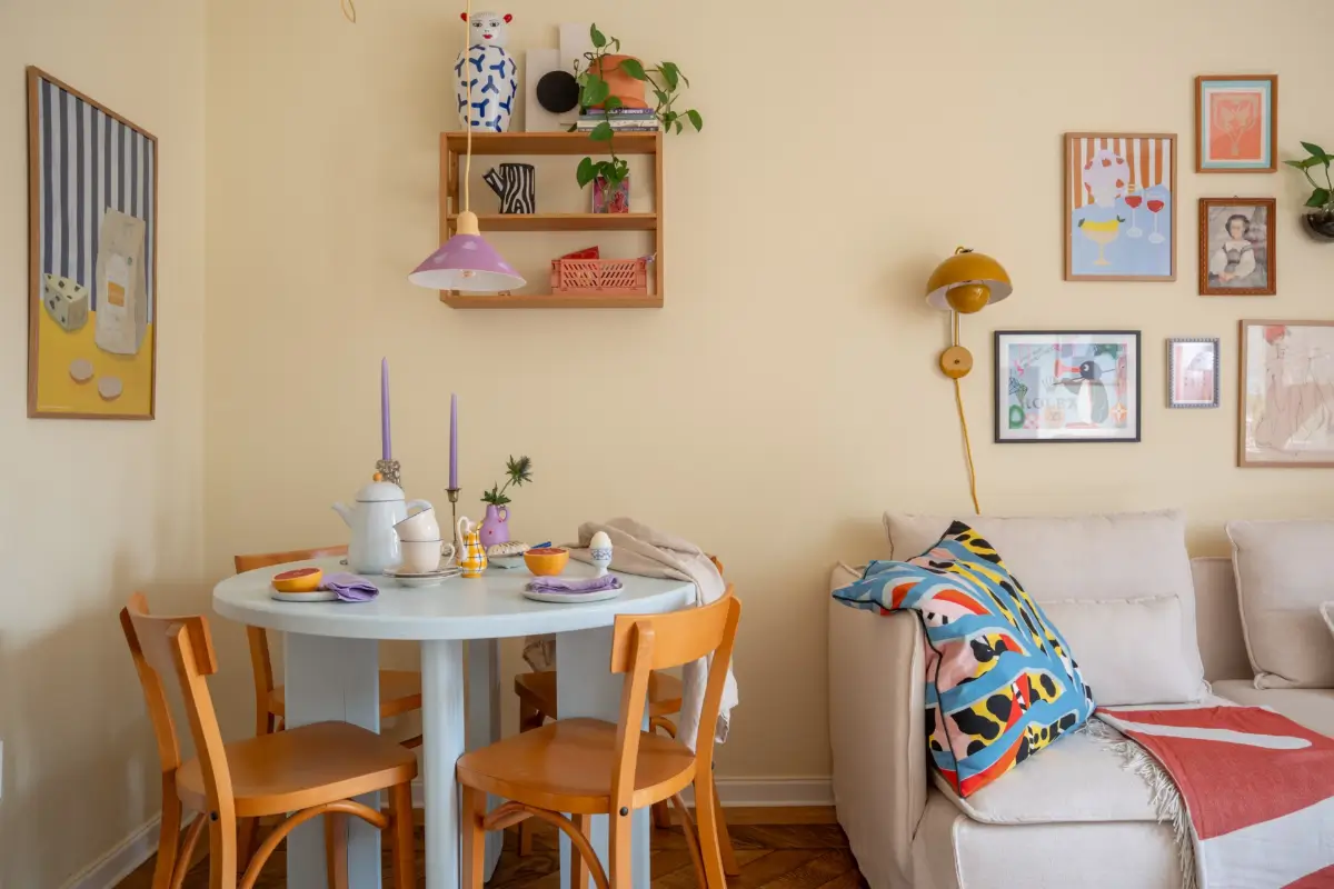Cheerful Colors in a Small & Light 1940s Apartment in Stockholm 11 pastel blue dining table purple pendant