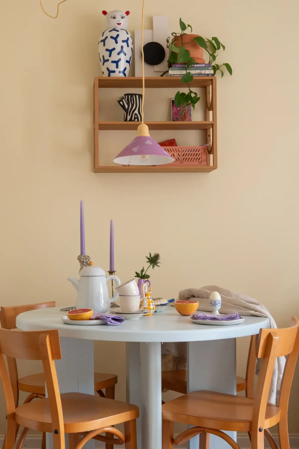 Cheerful Colors in a Small & Light 1940s Apartment in Stockholm 12 round pastel blue dining table