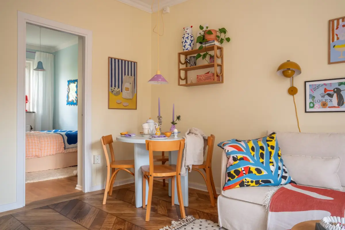 Cheerful Colors in a Small & Light 1940s Apartment in Stockholm 10 round-pastel-blue-dining-table-nordroom
