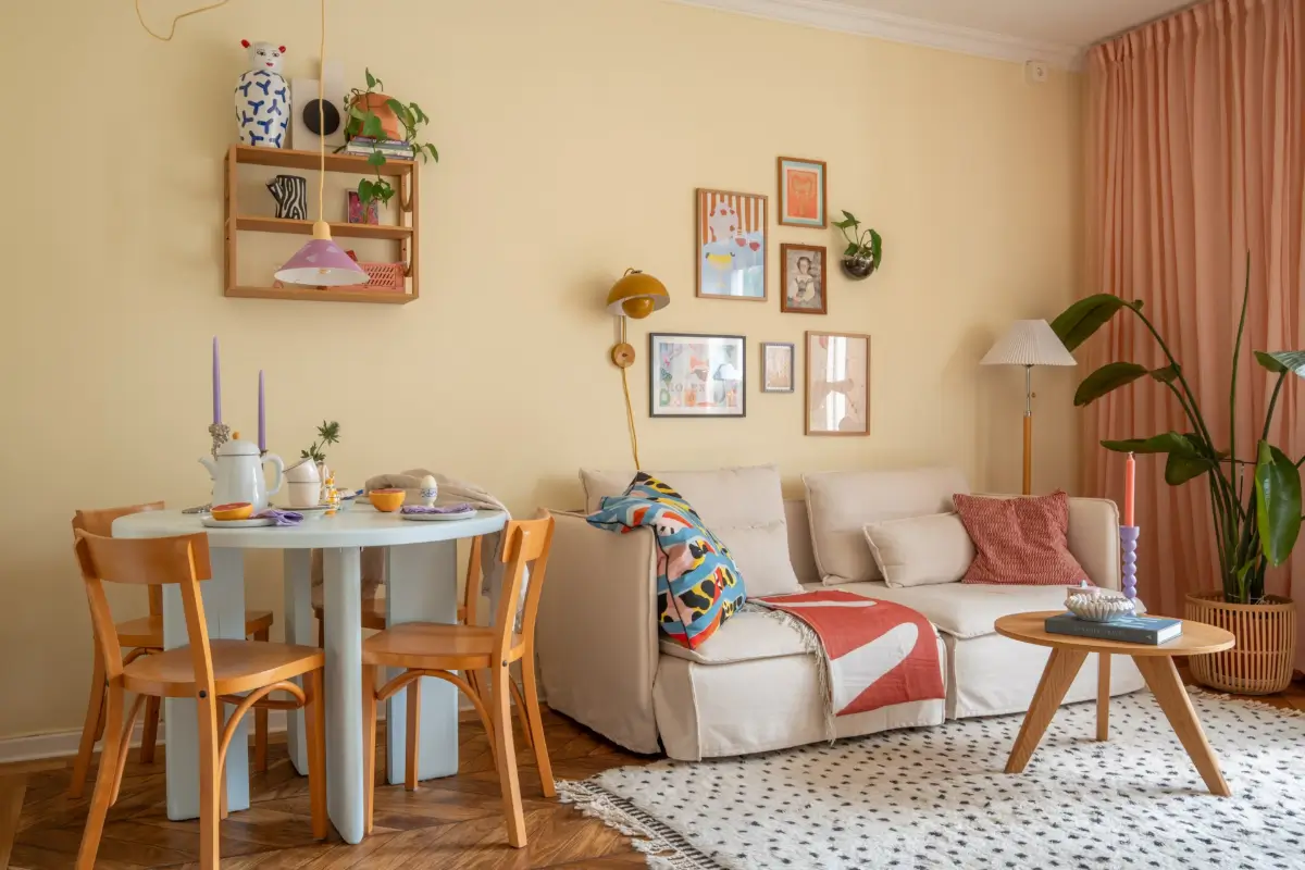 Cheerful Colors in a Small & Light 1940s Apartment in Stockholm 9 scandinavian living room light yellow walls pastel blue dining table nordroom