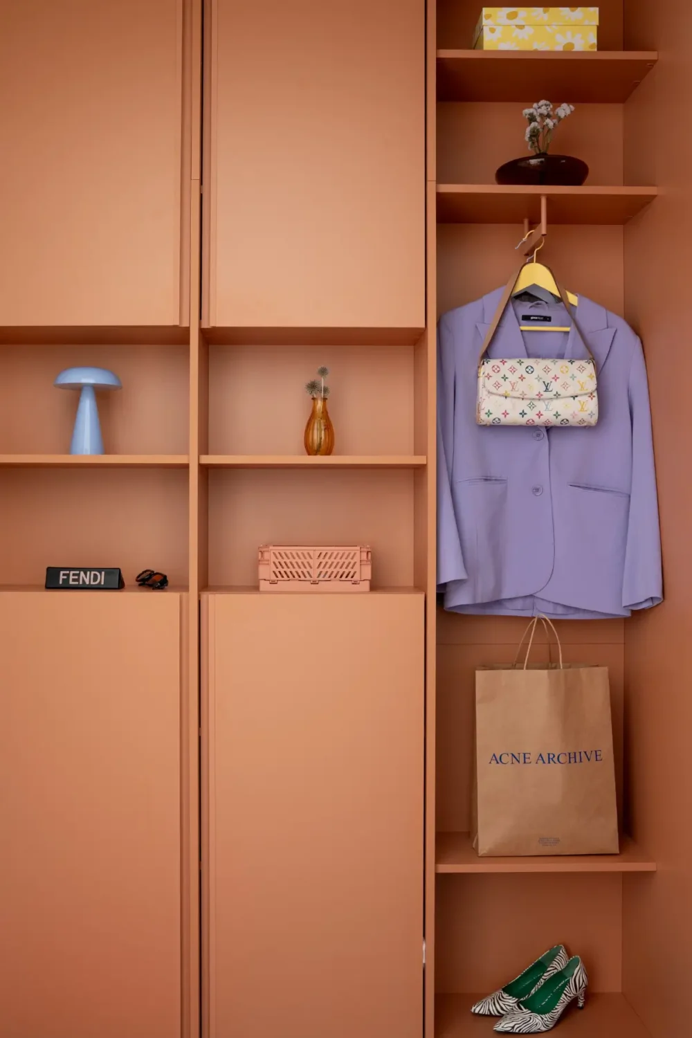 Cheerful Colors in a Small & Light 1940s Apartment in Stockholm 21 terracotta-colored-built-in-storage-hall-nordroom