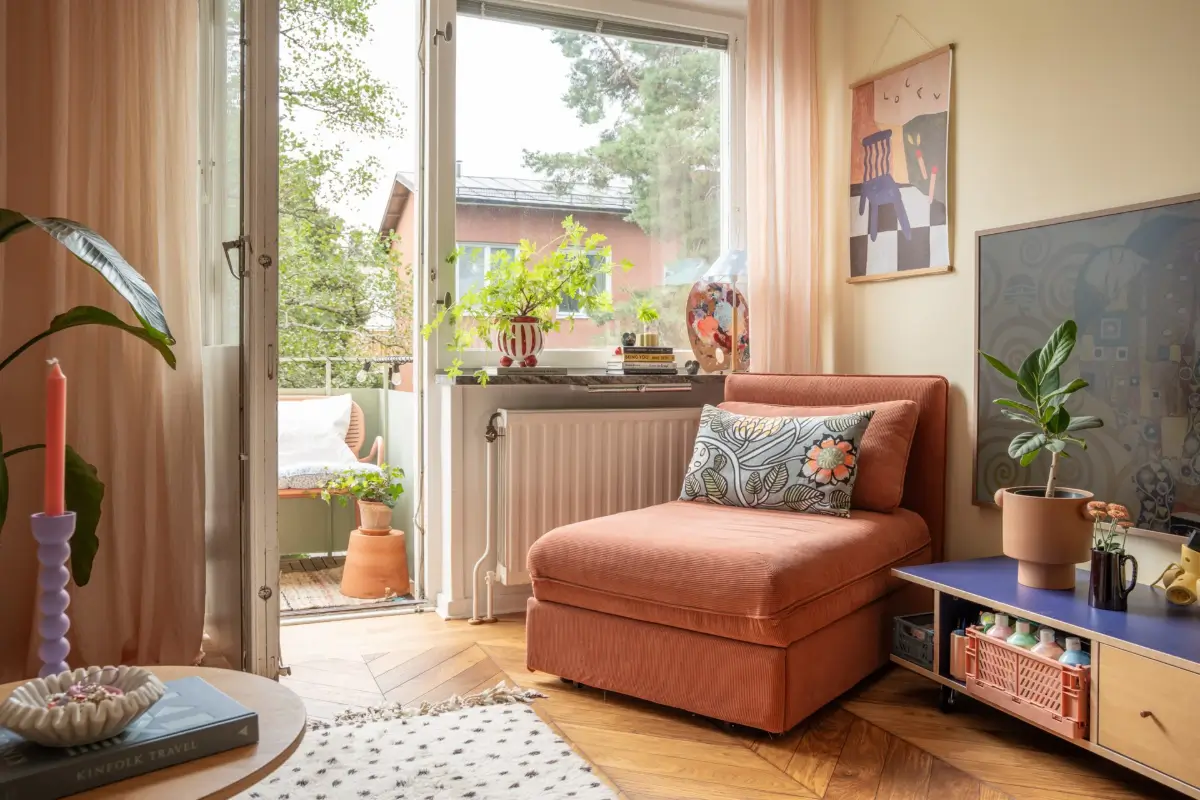 Cheerful Colors in a Small & Light 1940s Apartment in Stockholm 5 terracotta-colored-reading chair nordroom