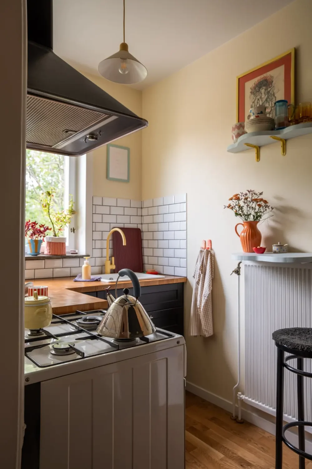 Cheerful Colors in a Small & Light 1940s Apartment in Stockholm 22 tiny-kitchen-small-bar-table-white-tiles-nordroom